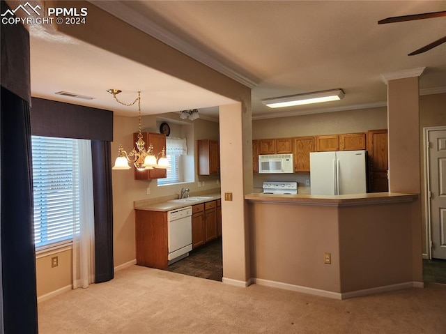 kitchen featuring carpet flooring, sink, hanging light fixtures, kitchen peninsula, and white appliances