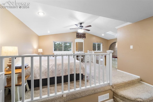 interior space with vaulted ceiling and carpet flooring