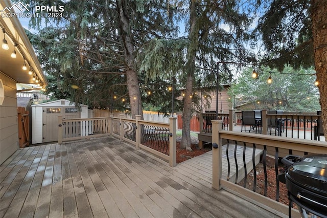 wooden deck featuring a storage shed