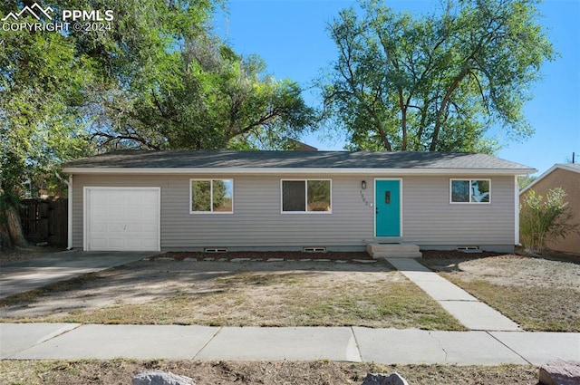 single story home with a garage