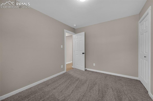 unfurnished bedroom with carpet