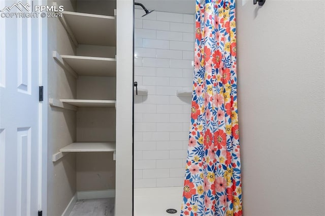 bathroom featuring a shower with curtain