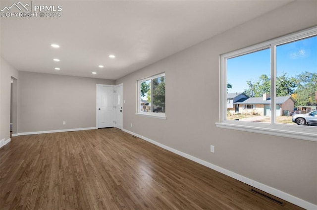 unfurnished room featuring wood-type flooring