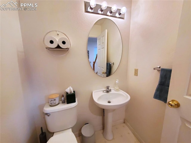 bathroom featuring toilet