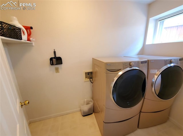 laundry area with washer and dryer