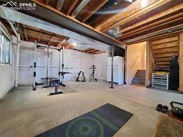 exercise area featuring concrete floors