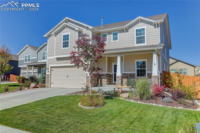 view of front of house featuring a garage and a front yard