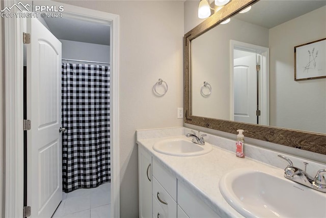 bathroom with tile patterned flooring and vanity