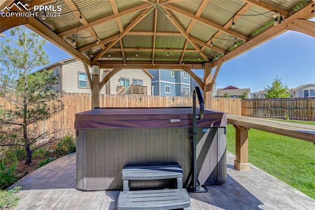 view of patio / terrace with a gazebo and a hot tub