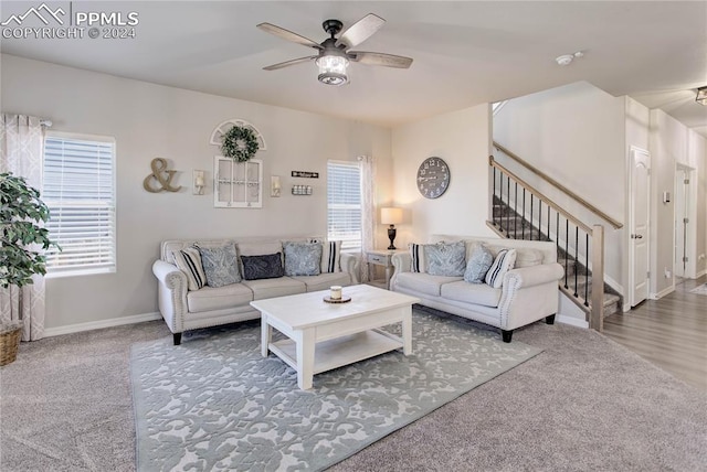 carpeted living room featuring ceiling fan