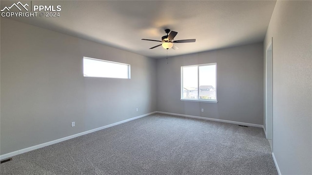 unfurnished room with ceiling fan and carpet floors