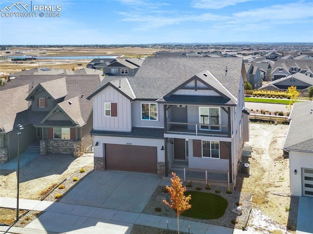 view of front of home featuring a garage and cooling unit