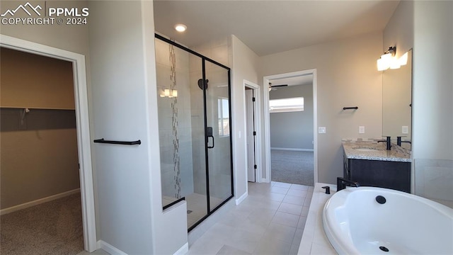 bathroom with vanity and separate shower and tub