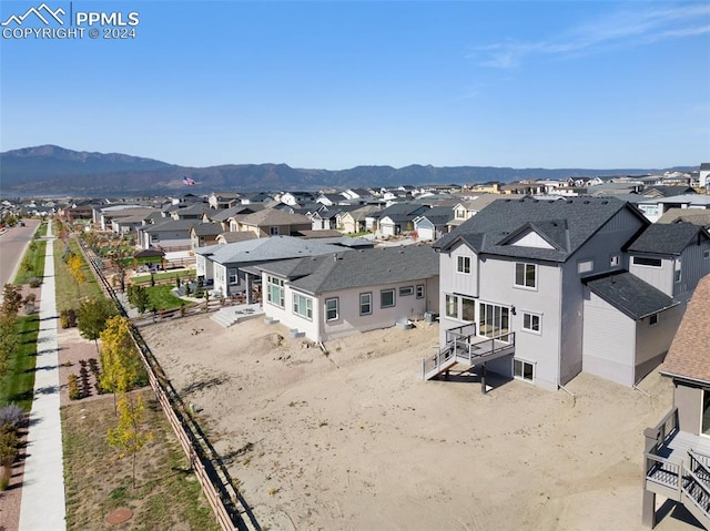 birds eye view of property featuring a mountain view