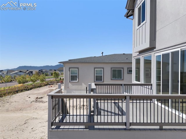 rear view of property featuring a mountain view