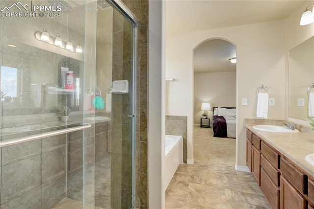 bathroom with vanity and plus walk in shower