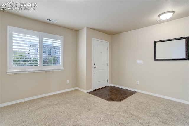 spare room featuring carpet flooring