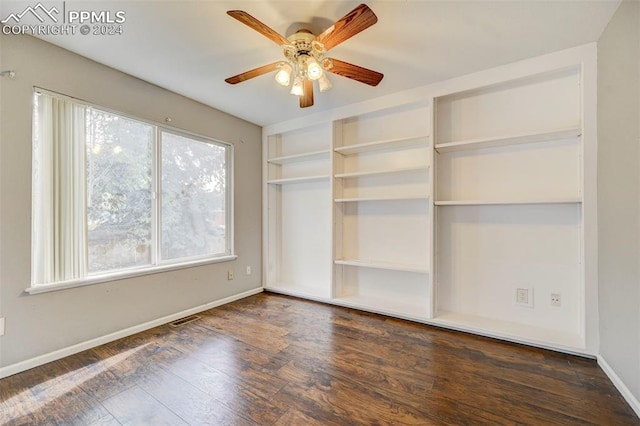 unfurnished bedroom with dark wood-type flooring and ceiling fan