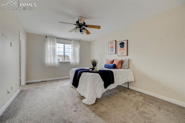 carpeted bedroom featuring ceiling fan