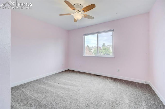 empty room featuring carpet and ceiling fan