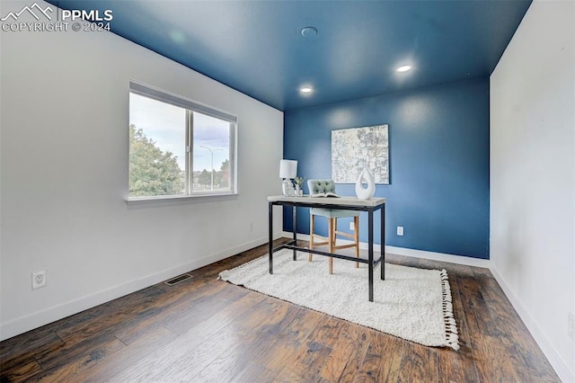 office with dark hardwood / wood-style flooring