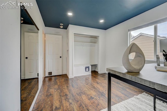 unfurnished office featuring dark hardwood / wood-style floors