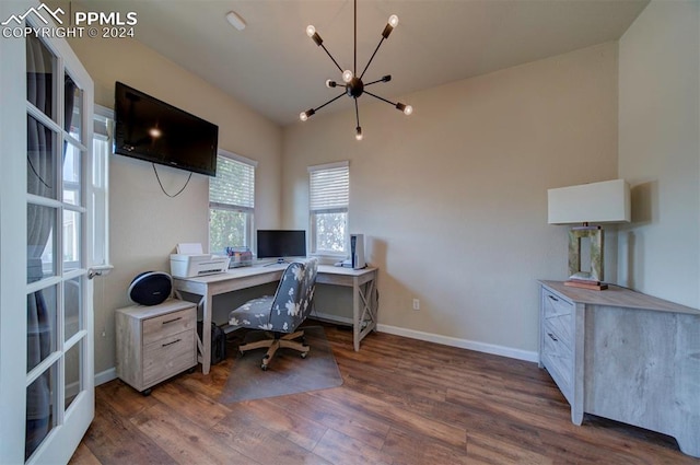 office area featuring a chandelier and dark hardwood / wood-style floors