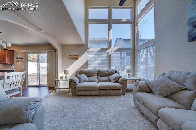 living room with carpet floors and a textured ceiling