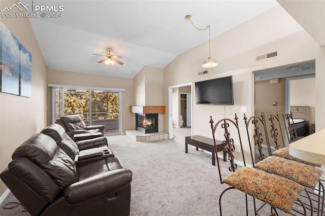 living room featuring ceiling fan, a multi sided fireplace, lofted ceiling, and carpet flooring