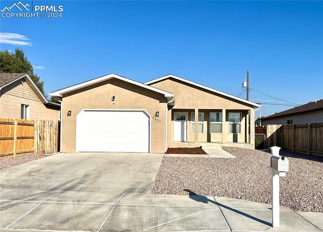 ranch-style home featuring a garage