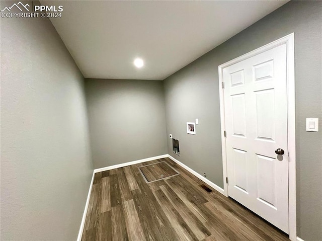 laundry area featuring washer hookup and hardwood / wood-style floors