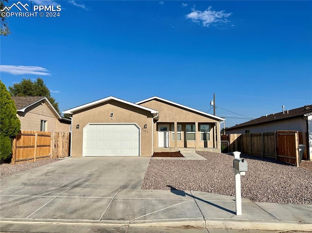 single story home featuring a garage