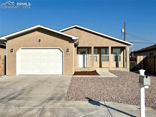 ranch-style home featuring a garage