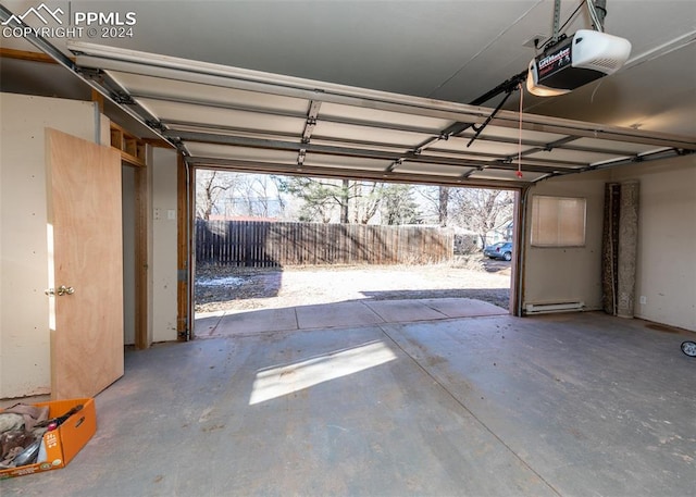 garage with a baseboard radiator and a garage door opener