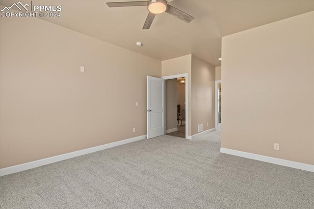 empty room with light carpet and ceiling fan