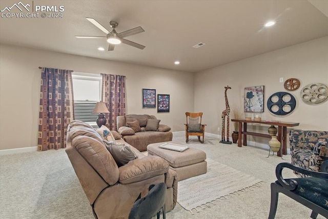 carpeted living room featuring ceiling fan