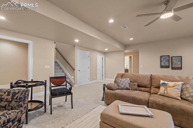 living room featuring ceiling fan and light colored carpet