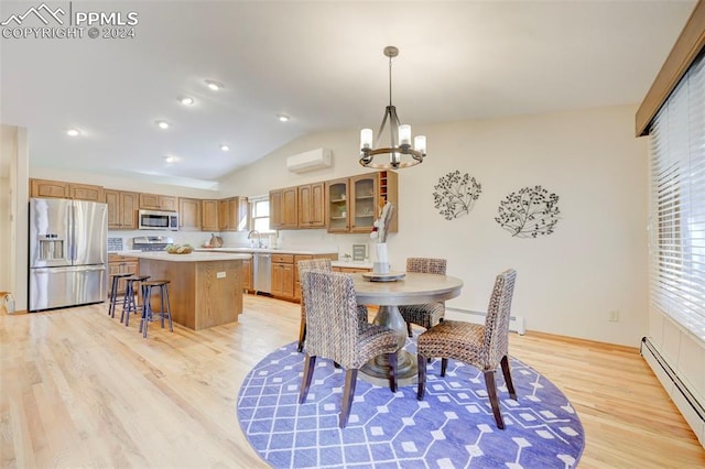 dining area featuring an inviting chandelier, baseboard heating, lofted ceiling, and light hardwood / wood-style flooring