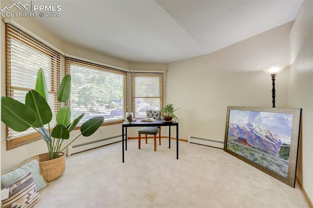 sitting room featuring carpet floors and baseboard heating