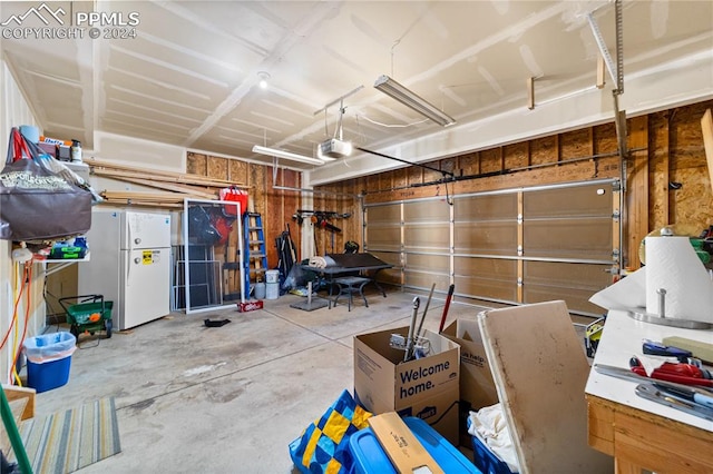 garage featuring white fridge