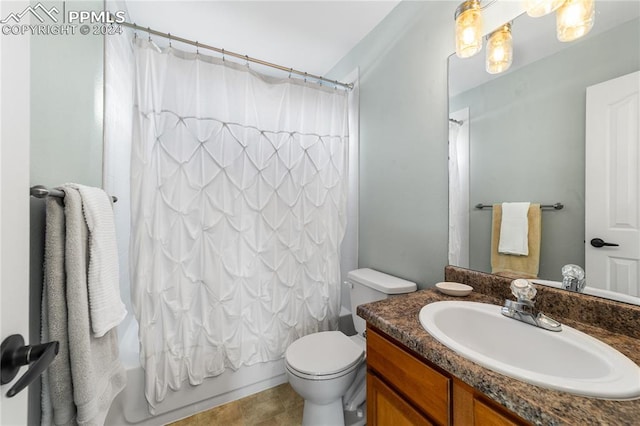 full bathroom featuring toilet, shower / bathtub combination with curtain, vanity, and tile patterned flooring