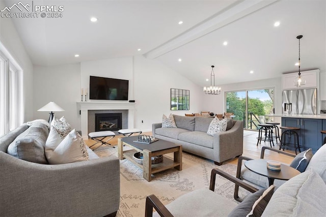 living room featuring a notable chandelier, vaulted ceiling with beams, and light hardwood / wood-style floors