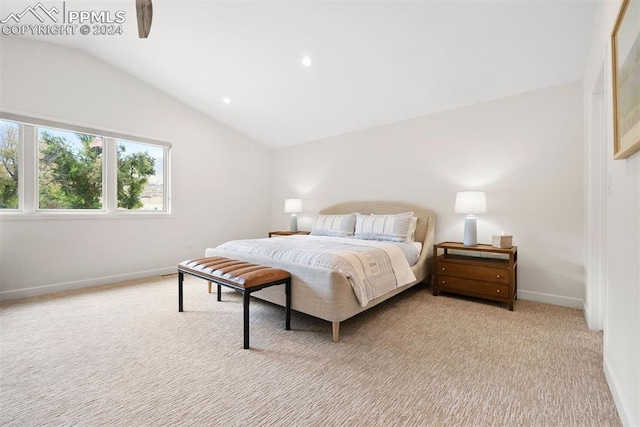 carpeted bedroom with vaulted ceiling