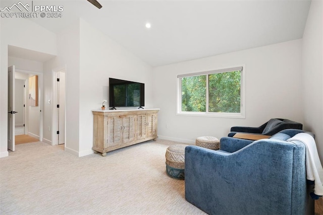 living room featuring light carpet and high vaulted ceiling