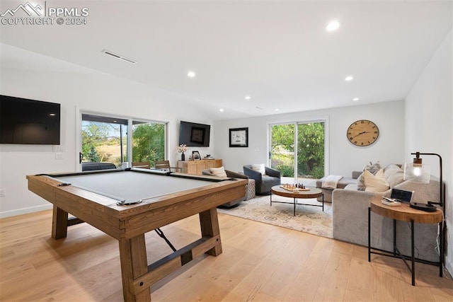 game room with pool table, plenty of natural light, light hardwood / wood-style floors, and vaulted ceiling