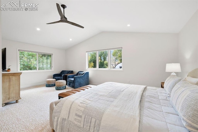 bedroom with ceiling fan, light colored carpet, lofted ceiling, and multiple windows