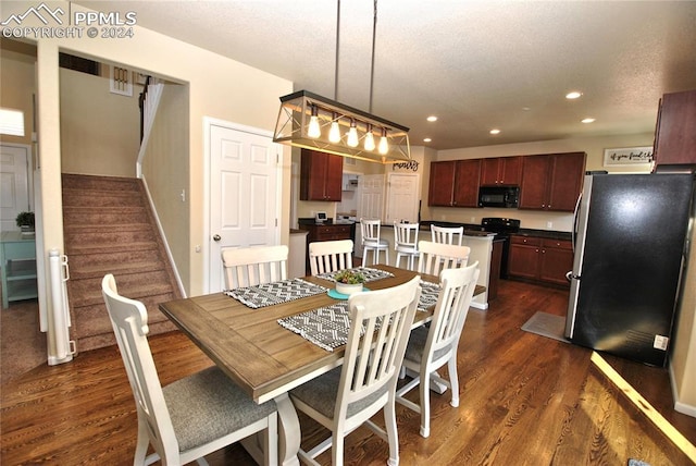 dining room featuring dark hardwood / wood-style flooring