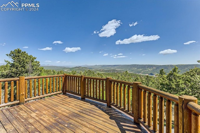 wooden terrace with a mountain view