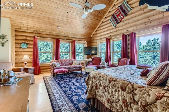 bedroom featuring high vaulted ceiling, multiple windows, light wood-type flooring, and wooden ceiling