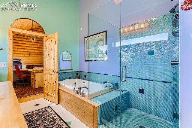 bathroom featuring shower with separate bathtub and hardwood / wood-style flooring